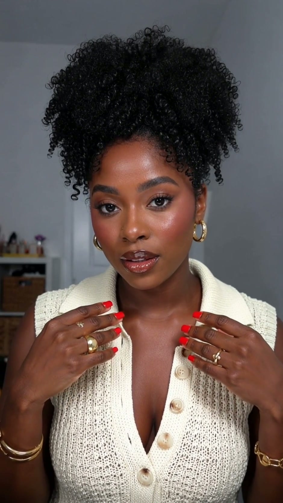 A beauty professional checking her Bookwan site on a phone